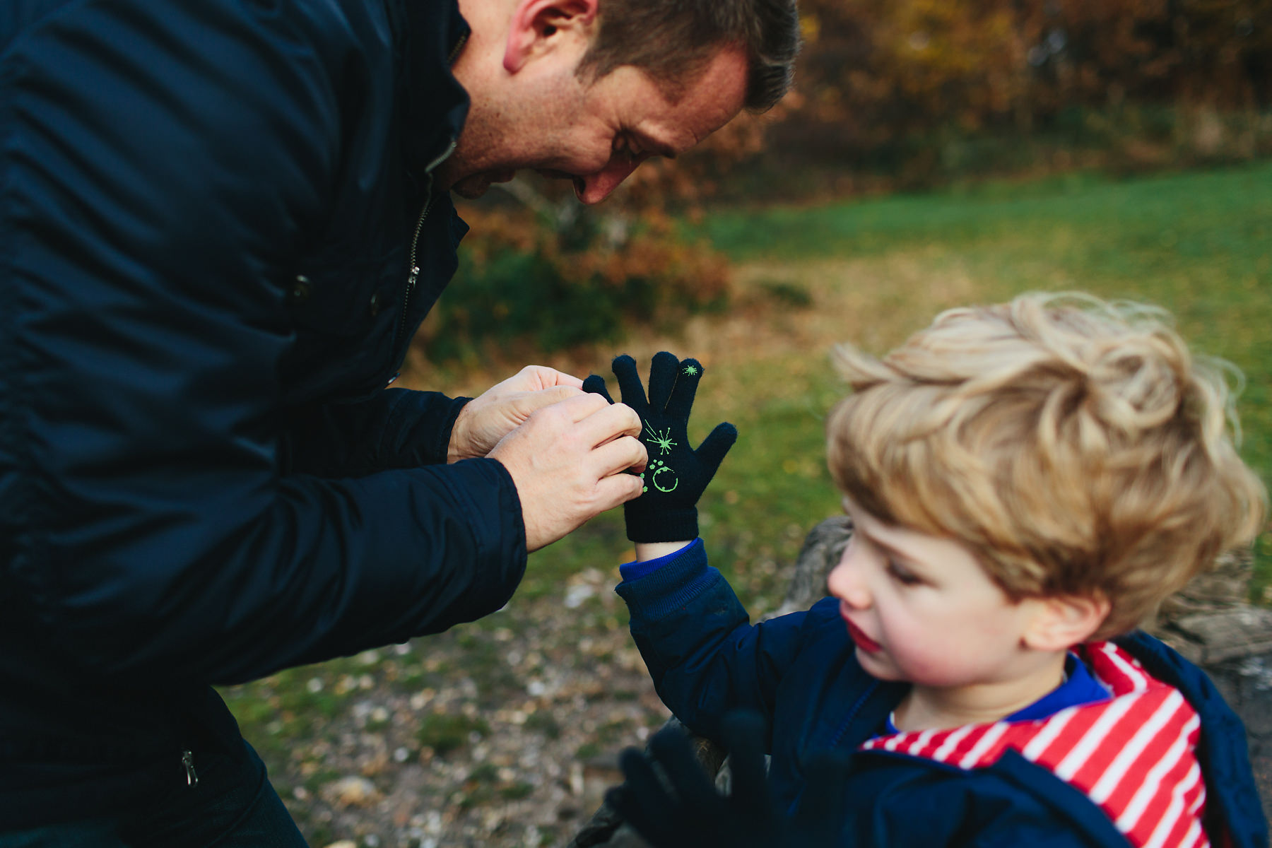 Dad helping hand with gloves